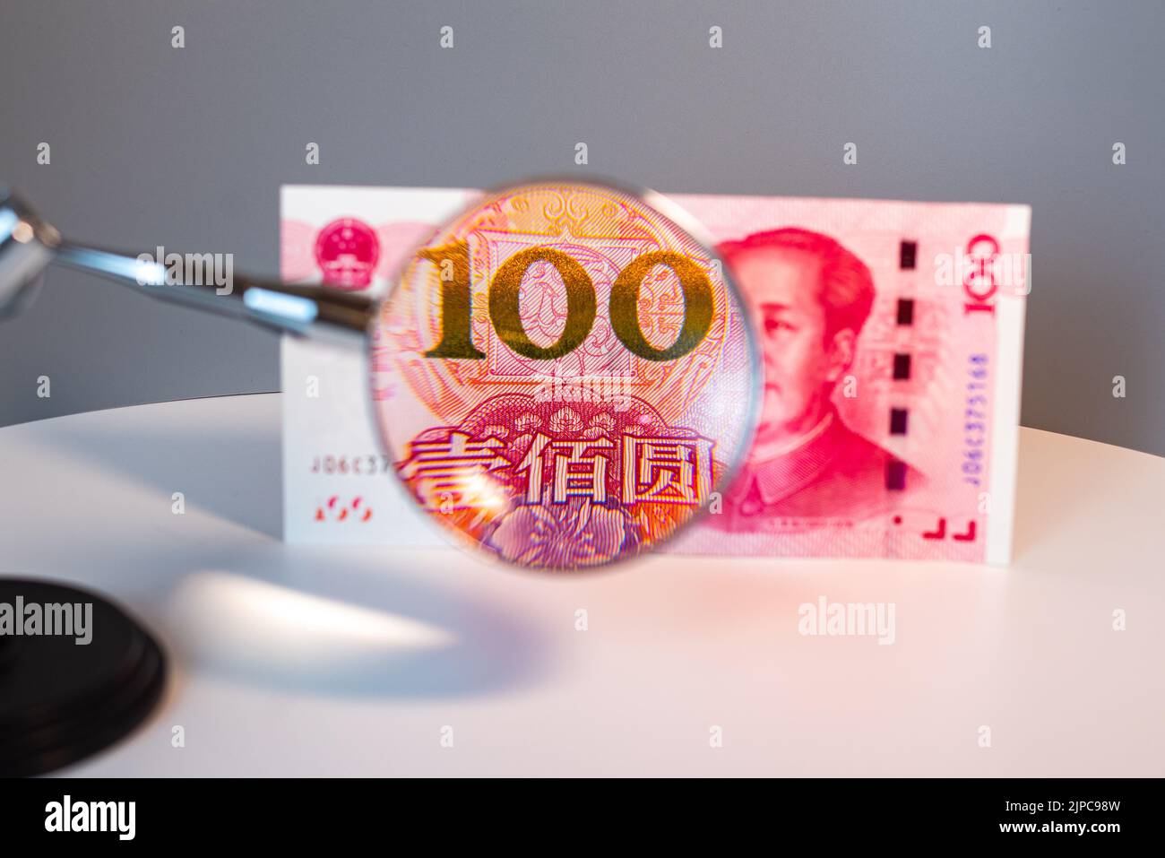 Closeup of chinese currency: Renminbi (RMB).The People`s Bank of China 100 yuan currency, economy, RMB, finance, investment, interest rate Stock Photo